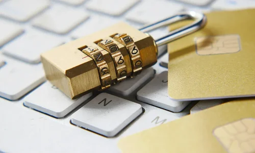 a-golden-padlock-sitting-on-top-of-a-keyboard