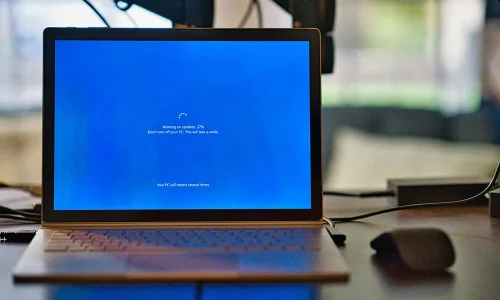 macbook-pro-on-brown-wooden-table-