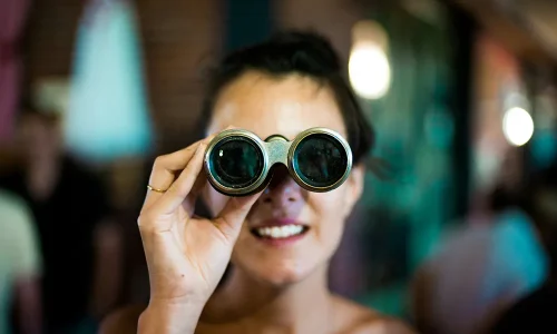 woman-using-gray-binoculars