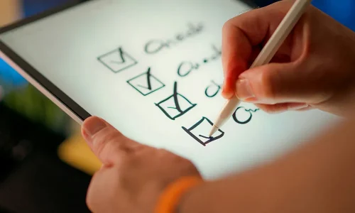 a-hand-marks-off-items-on-a-checklist